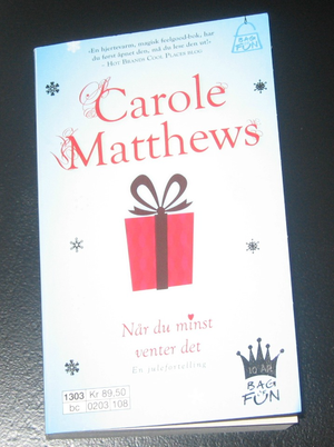 "Når du minst venter det En julefortelling" av Carole Matthews